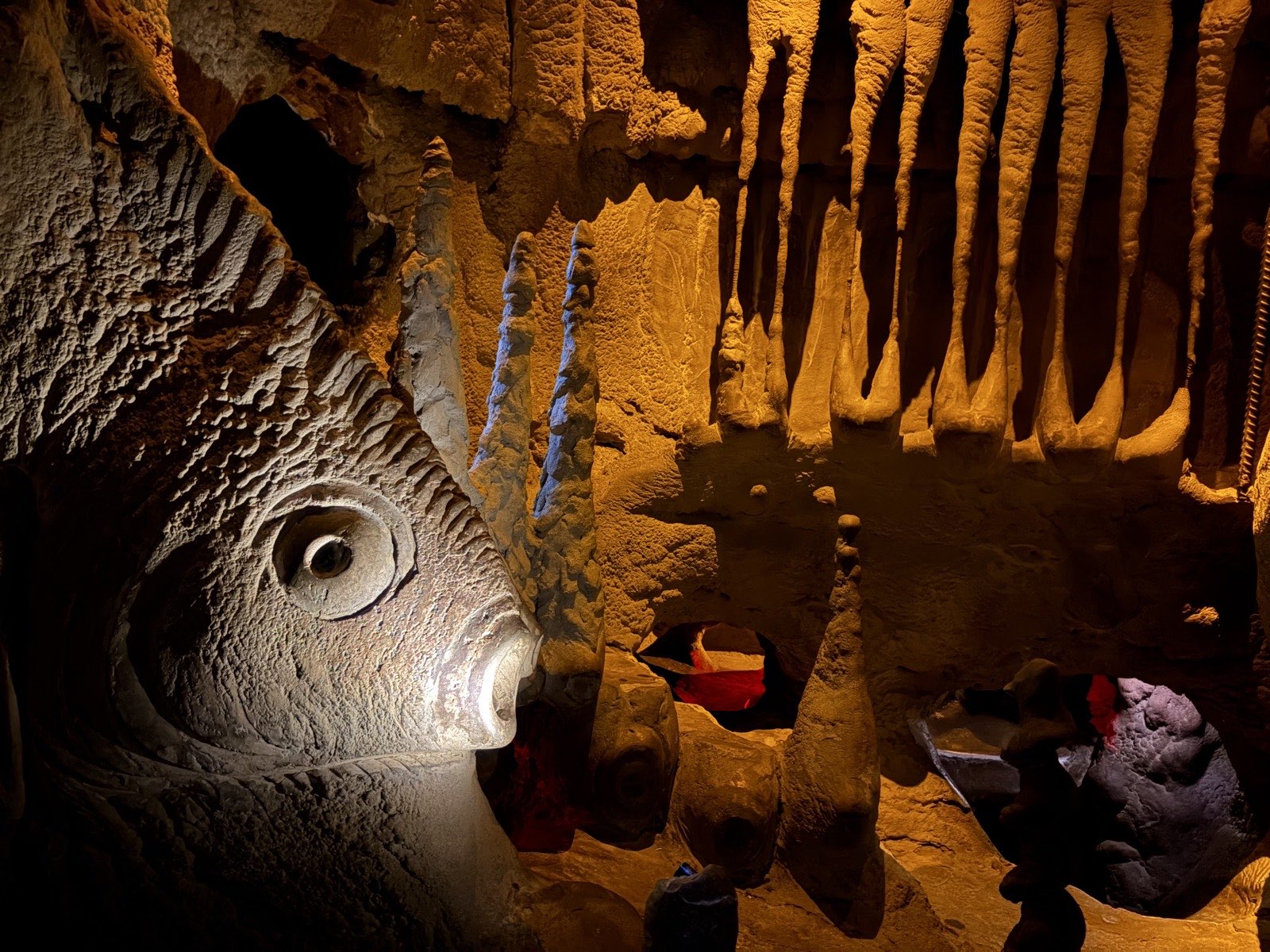 The interior cave system at City Museum — sculpted concrete tunnels and openings lit in warm light, built to be crawled through