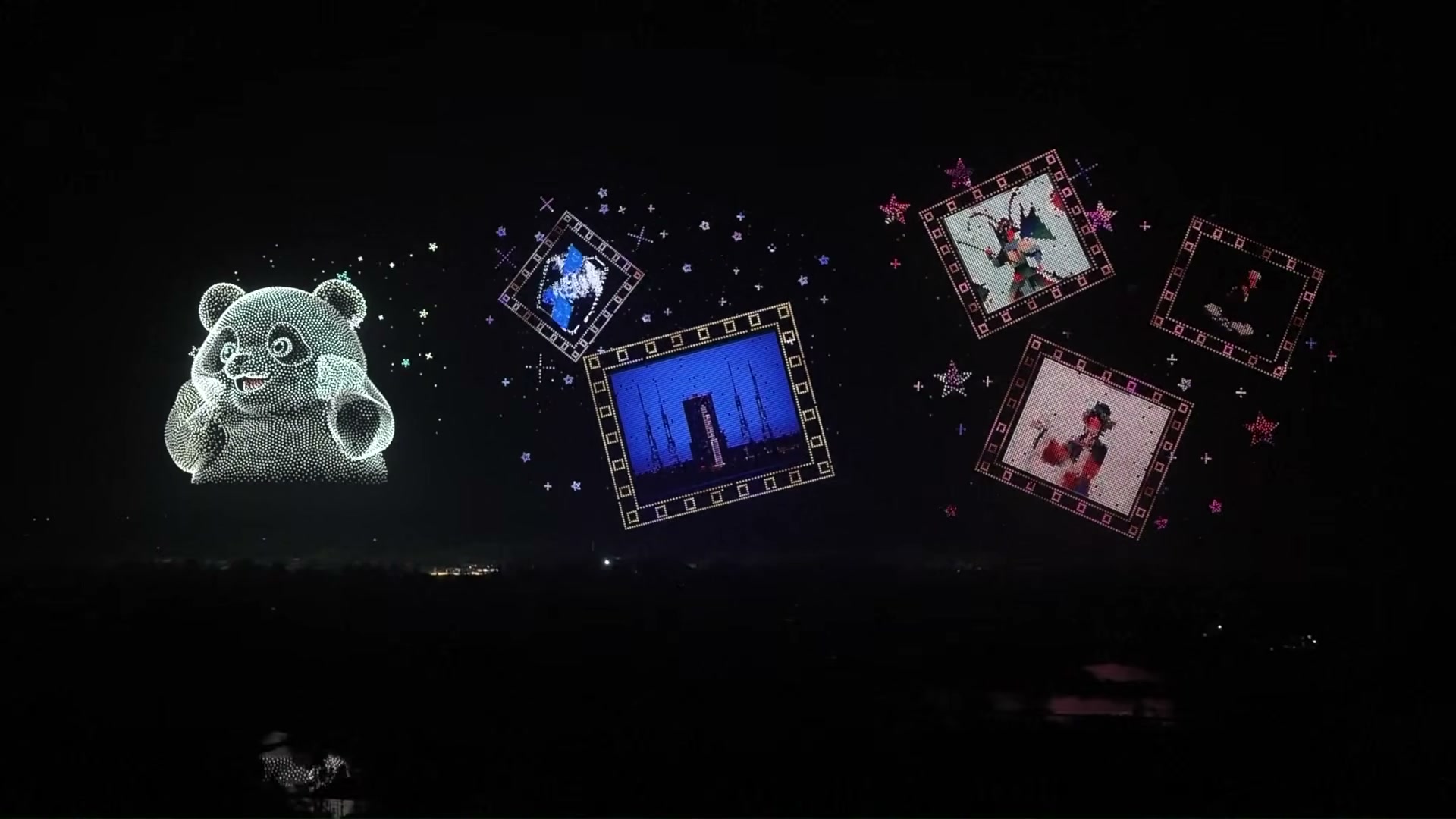 A giant panda made of white points of light beside five framed pictures hanging in the sky, one showing a rocket on its launch tower, with stars scattered between