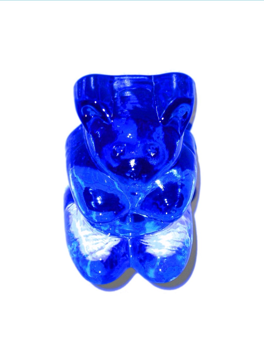 Close-up macro photograph of a single translucent gummy bear
