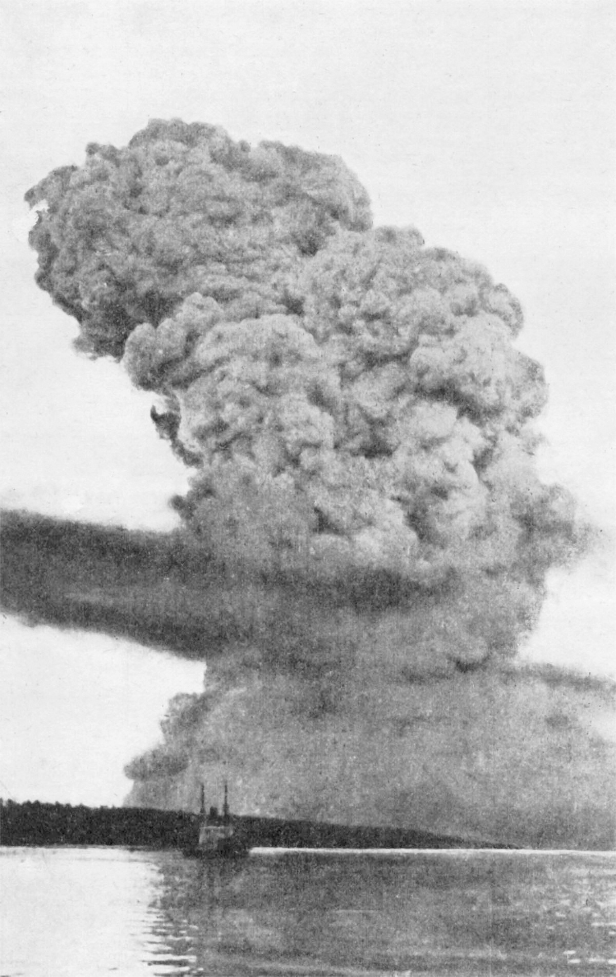 Archival photograph of the towering smoke cloud rising over Halifax harbour after the 1917 explosion