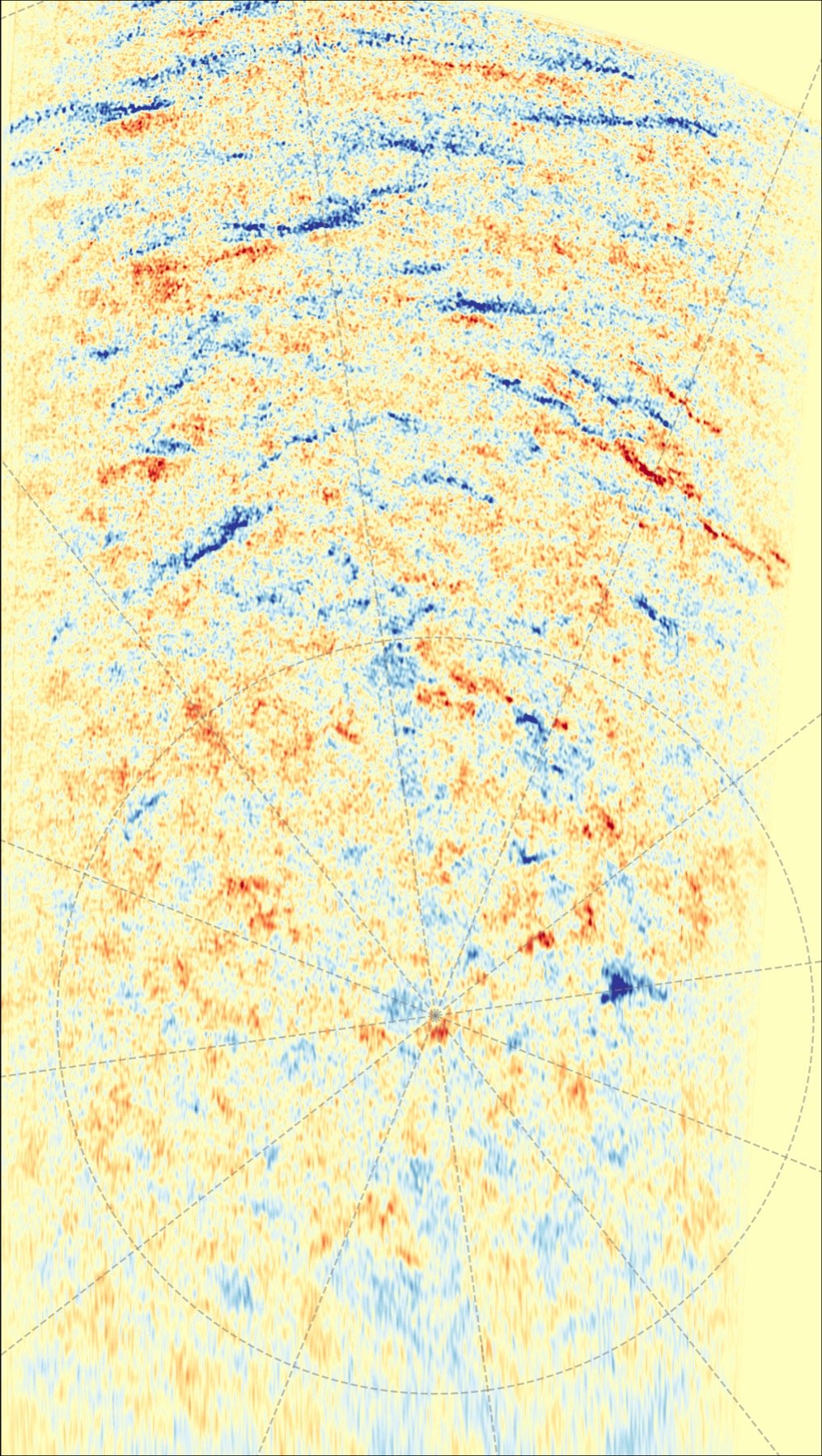 A tall view of the Sun's south pole showing patches of blue and red marking opposite magnetic polarities mixed together near the pole
