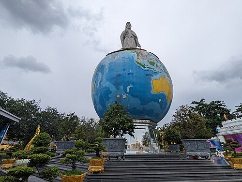 A giant model of planet Earth on a pedestal at Suoi Tien